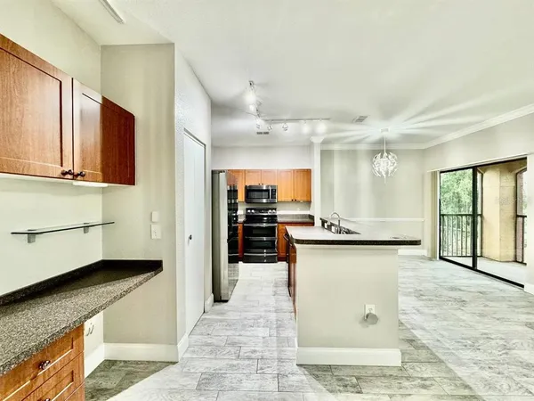 a kitchen with stainless steel appliances granite countertop a stove and a sink
