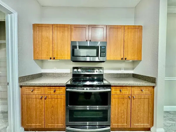 a kitchen with a stove and a microwave