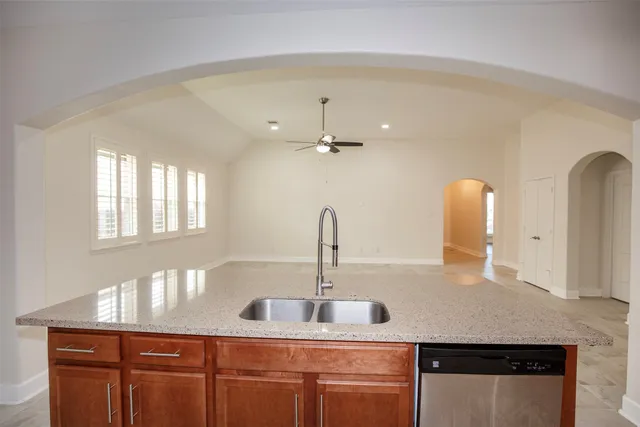 a kitchen with a sink and a refrigerator