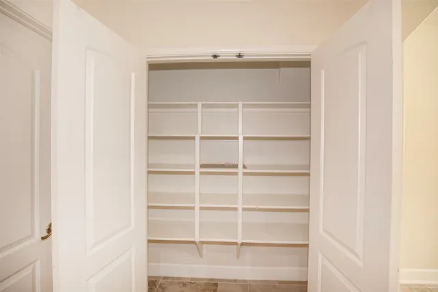a view of an empty walk in closet
