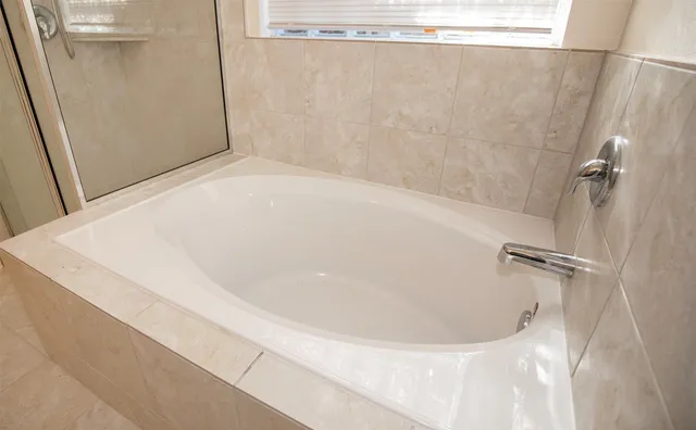 a close view of a bathtub in bathroom