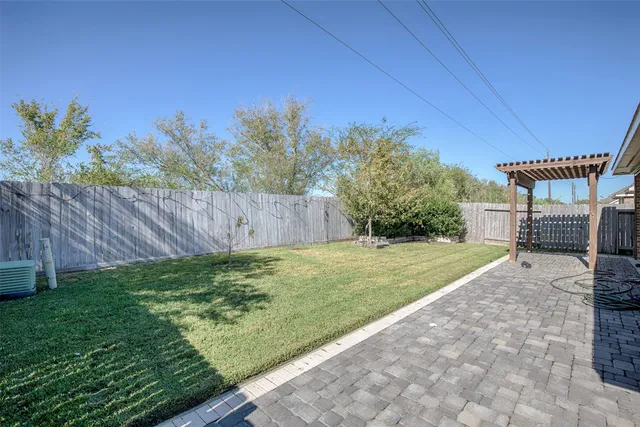 a view of a backyard with sitting area
