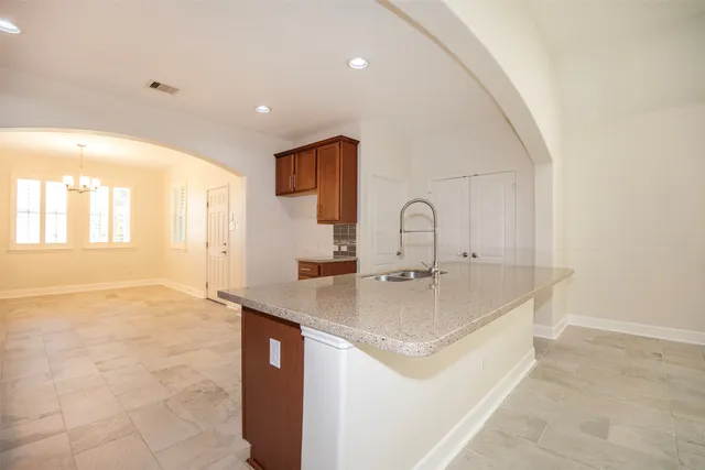 a kitchen with a sink and natural light