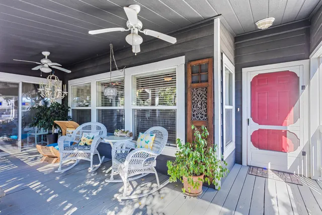 a view of a house with backyard and porch