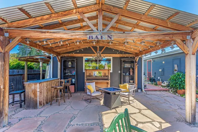a view of a balcony with furniture