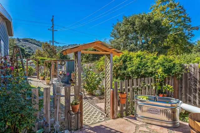 a outdoor living space with furniture and floor to ceiling window