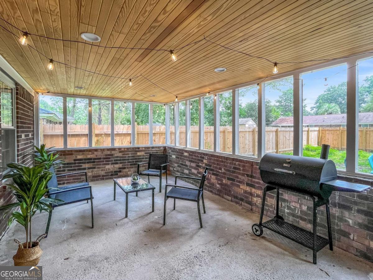 1224 Crawford Way Pooler, GA 31322 - Photo 12 of 12 a living room with furniture and a floor to ceiling window