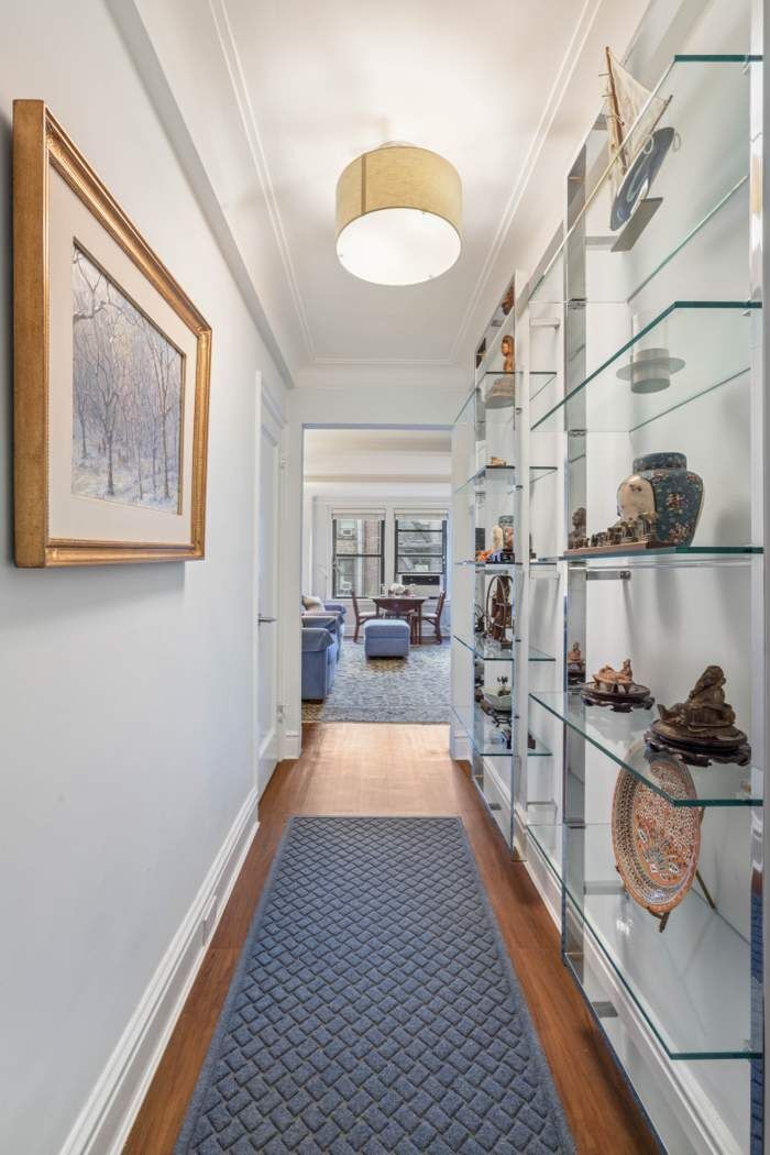 333 East 53rd Street, Unit 5B Manhattan, NY 10022 - Photo 5 of 12 a long hallway with furniture and a rug