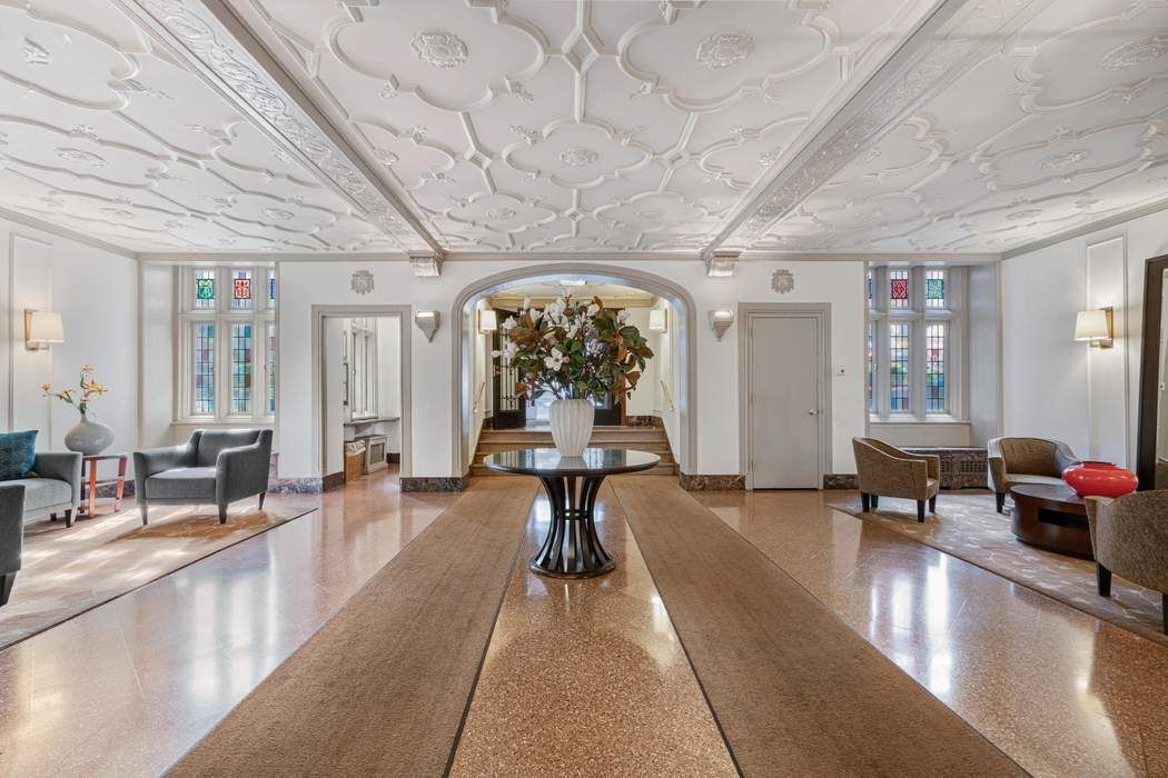 333 East 53rd Street, Unit 5B Manhattan, NY 10022 - Photo 8 of 12 a lobby with furniture and floor to ceiling window