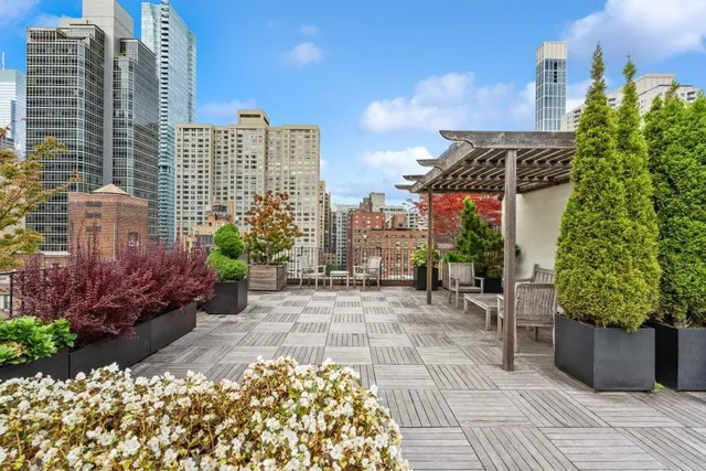a lobby with furniture and floor to ceiling window