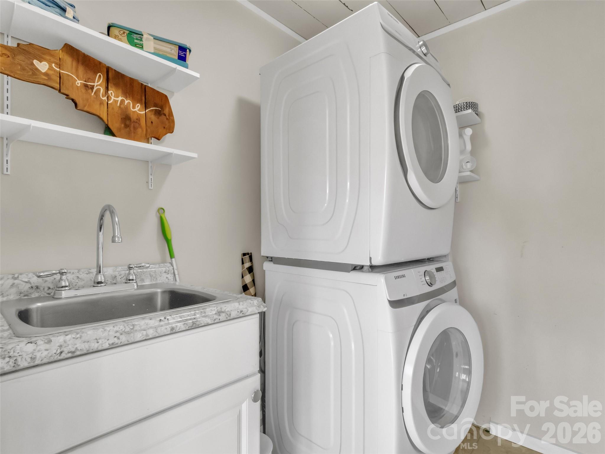 43 Melton Road Candler, NC 28715 - Photo 14 of 44 a utility room with dryer and washer