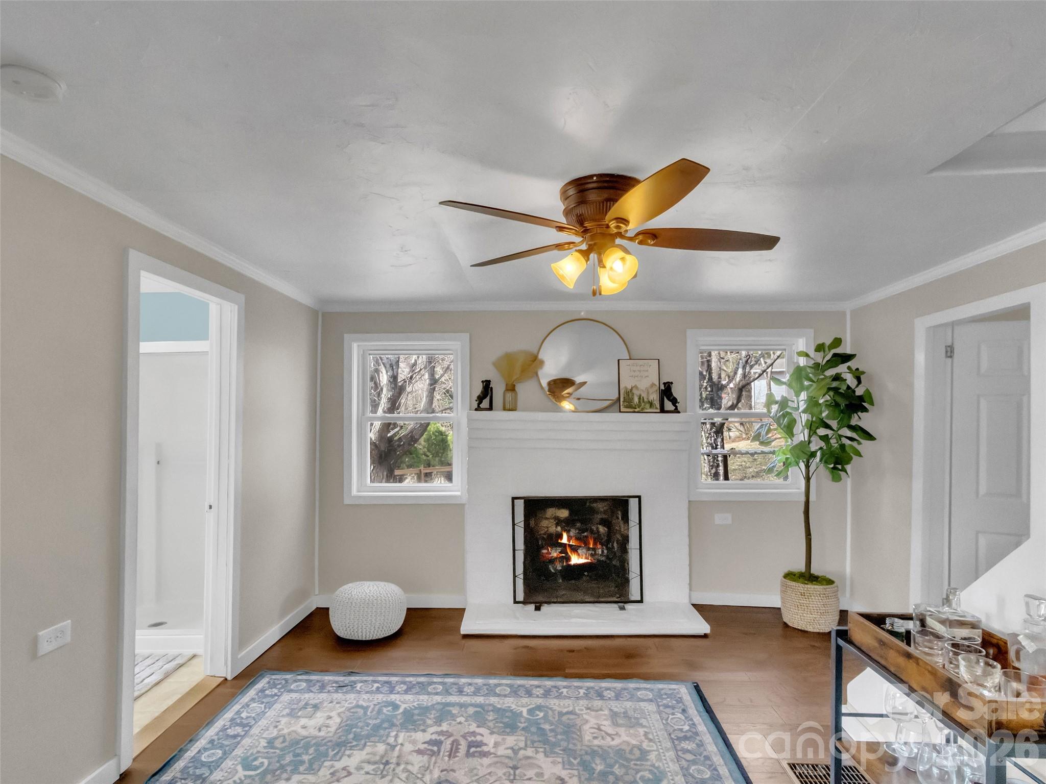 43 Melton Road Candler, NC 28715 - Photo 18 of 44 a living room with furniture and a fireplace