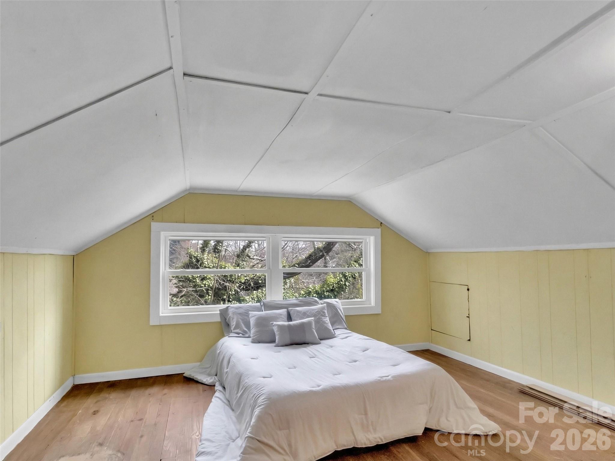 43 Melton Road Candler, NC 28715 - Photo 20 of 44 a bedroom with a large bed and a window