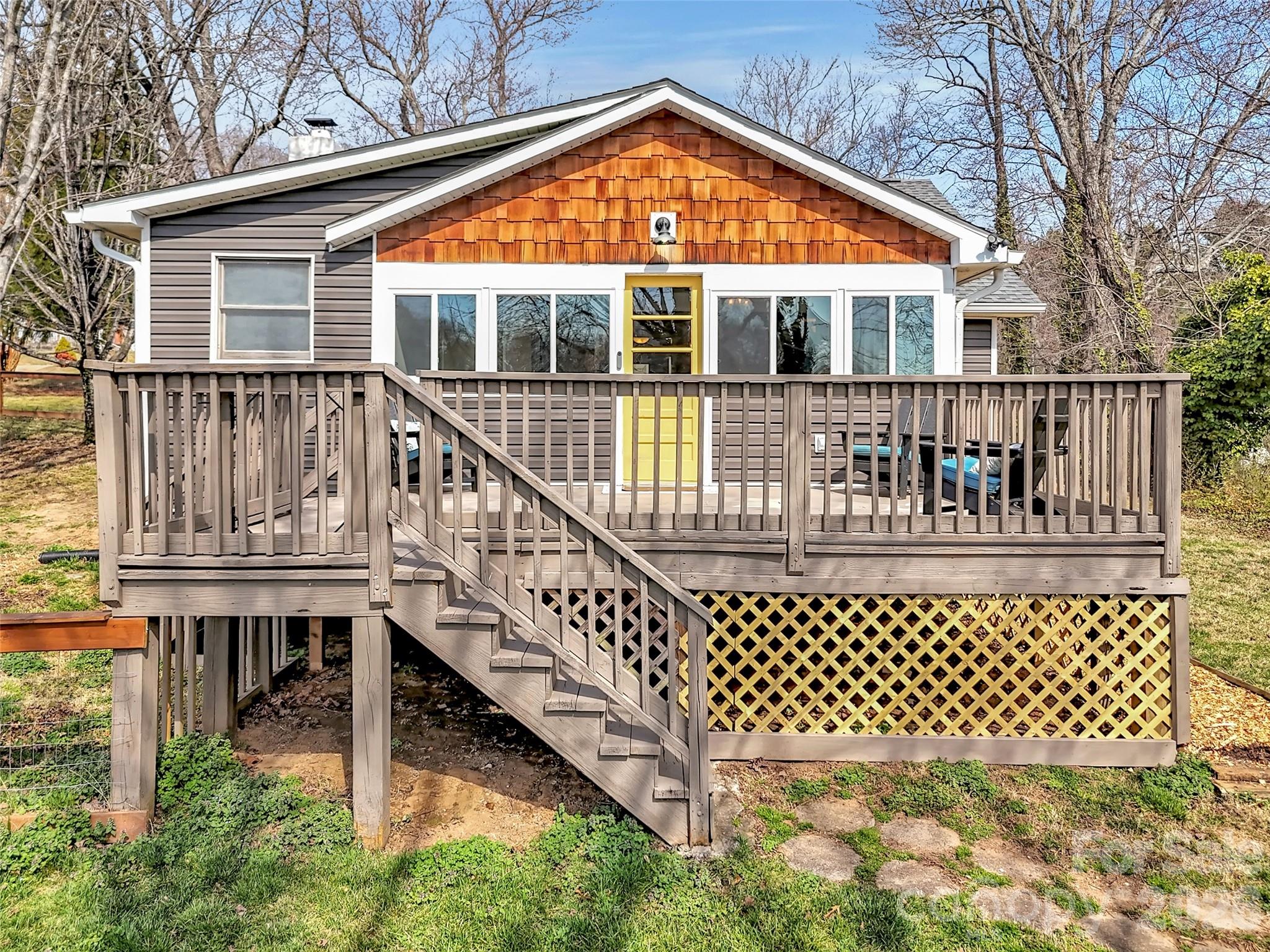 43 Melton Road Candler, NC 28715 - Photo 2 of 44 a view of a house with wooden fence