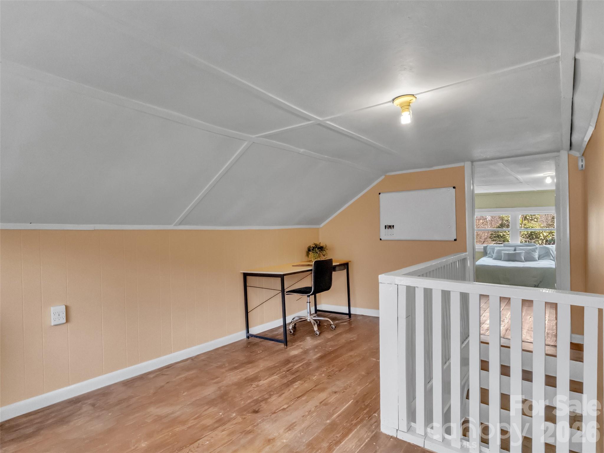 43 Melton Road Candler, NC 28715 - Photo 22 of 44 a view of a livingroom with wooden floor and furniture