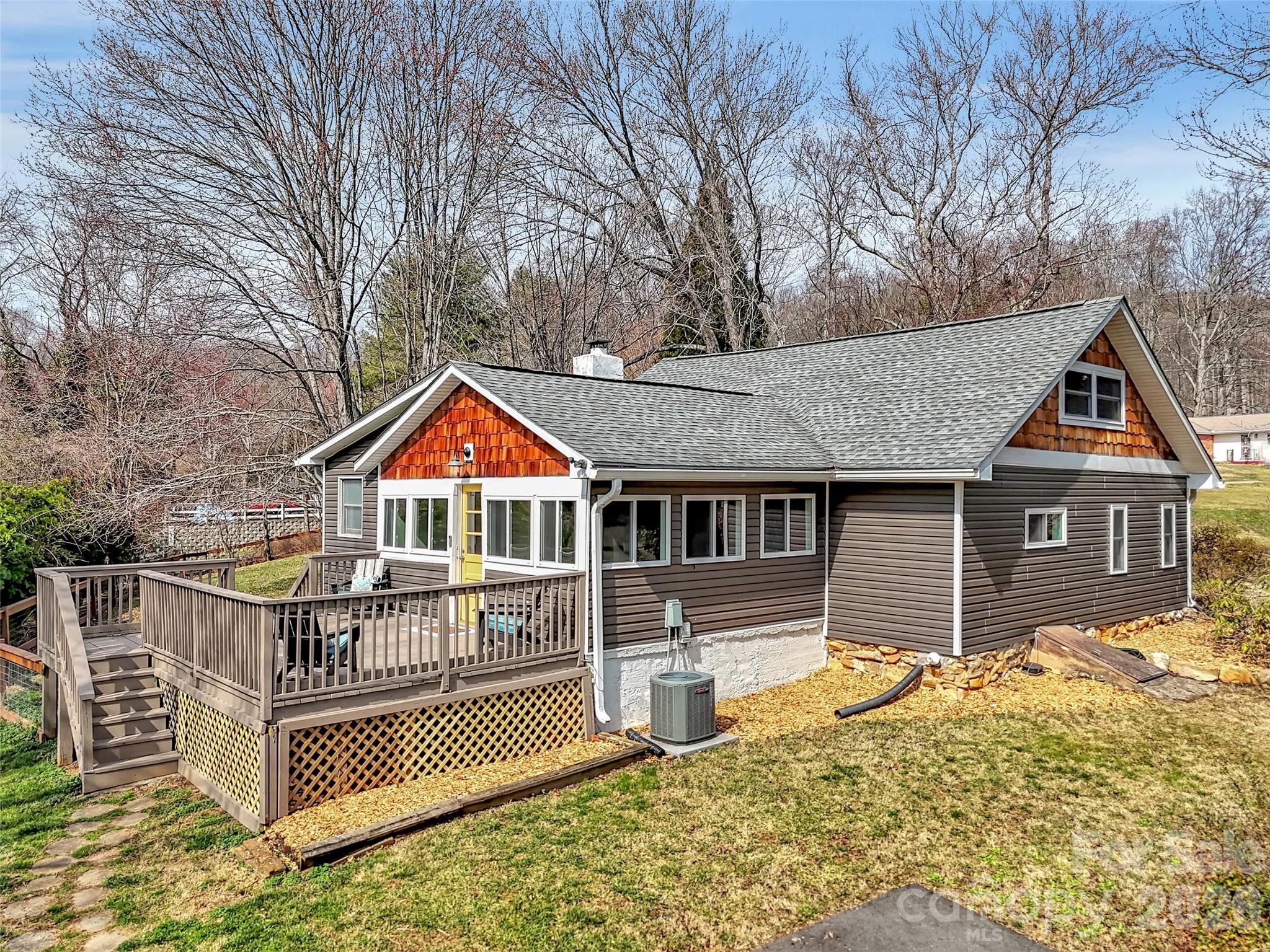 43 Melton Road Candler, NC 28715 - Photo 26 of 44 front view of a house with a yard