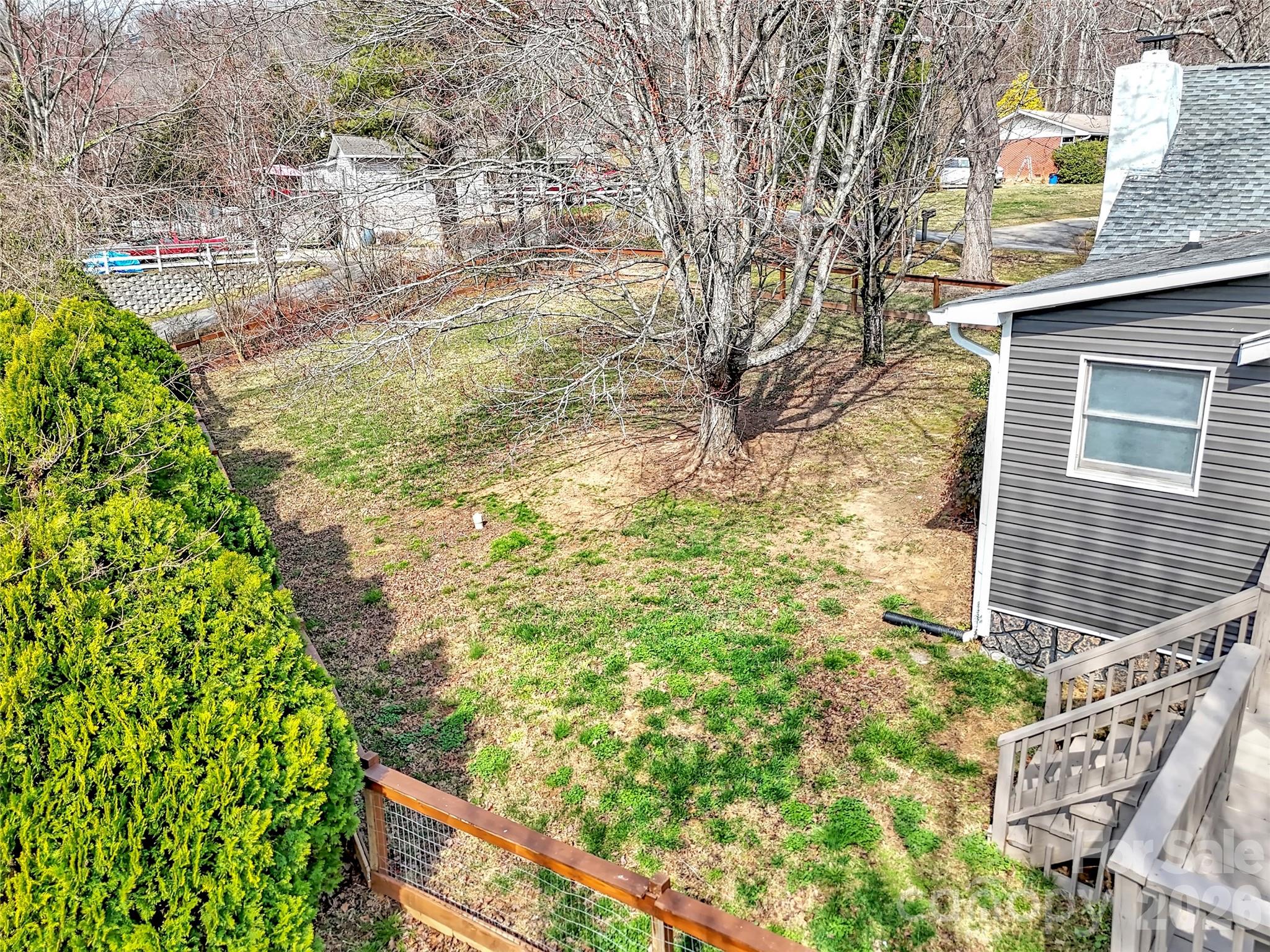 43 Melton Road Candler, NC 28715 - Photo 30 of 44 a view of a yard with plants and wooden fence