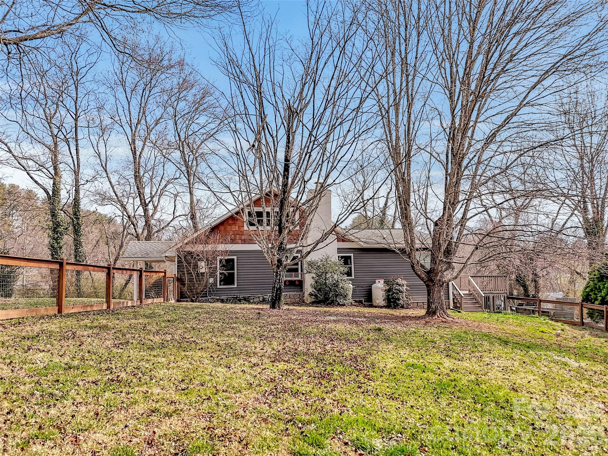 43 Melton Road Candler, NC 28715 - Photo 33 of 44 a front view of house with a yard covered in snow