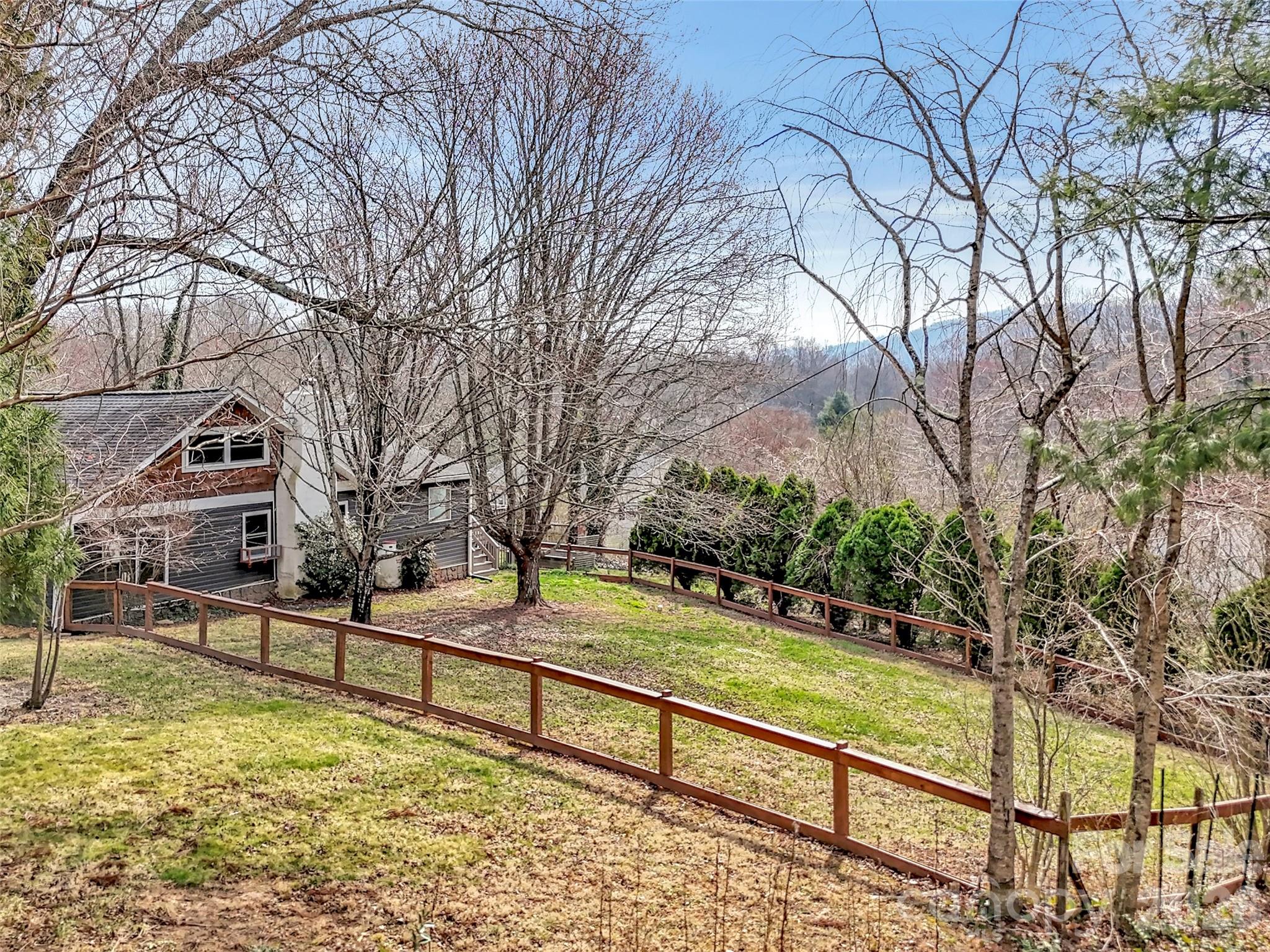 43 Melton Road Candler, NC 28715 - Photo 34 of 44 a view of backyard with large trees