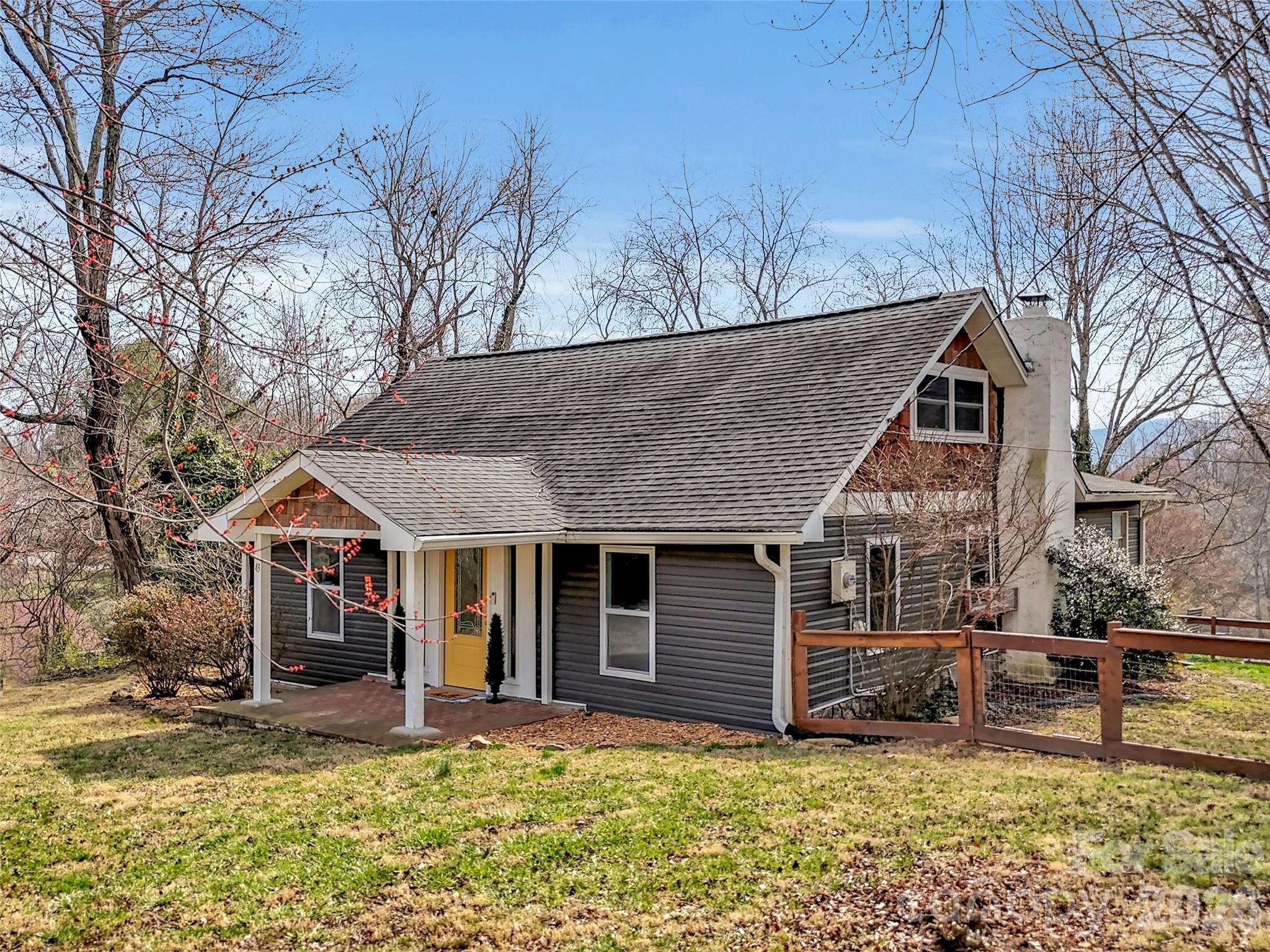 43 Melton Road Candler, NC 28715 - Photo 36 of 44 a view of a house with a yard covered in snow