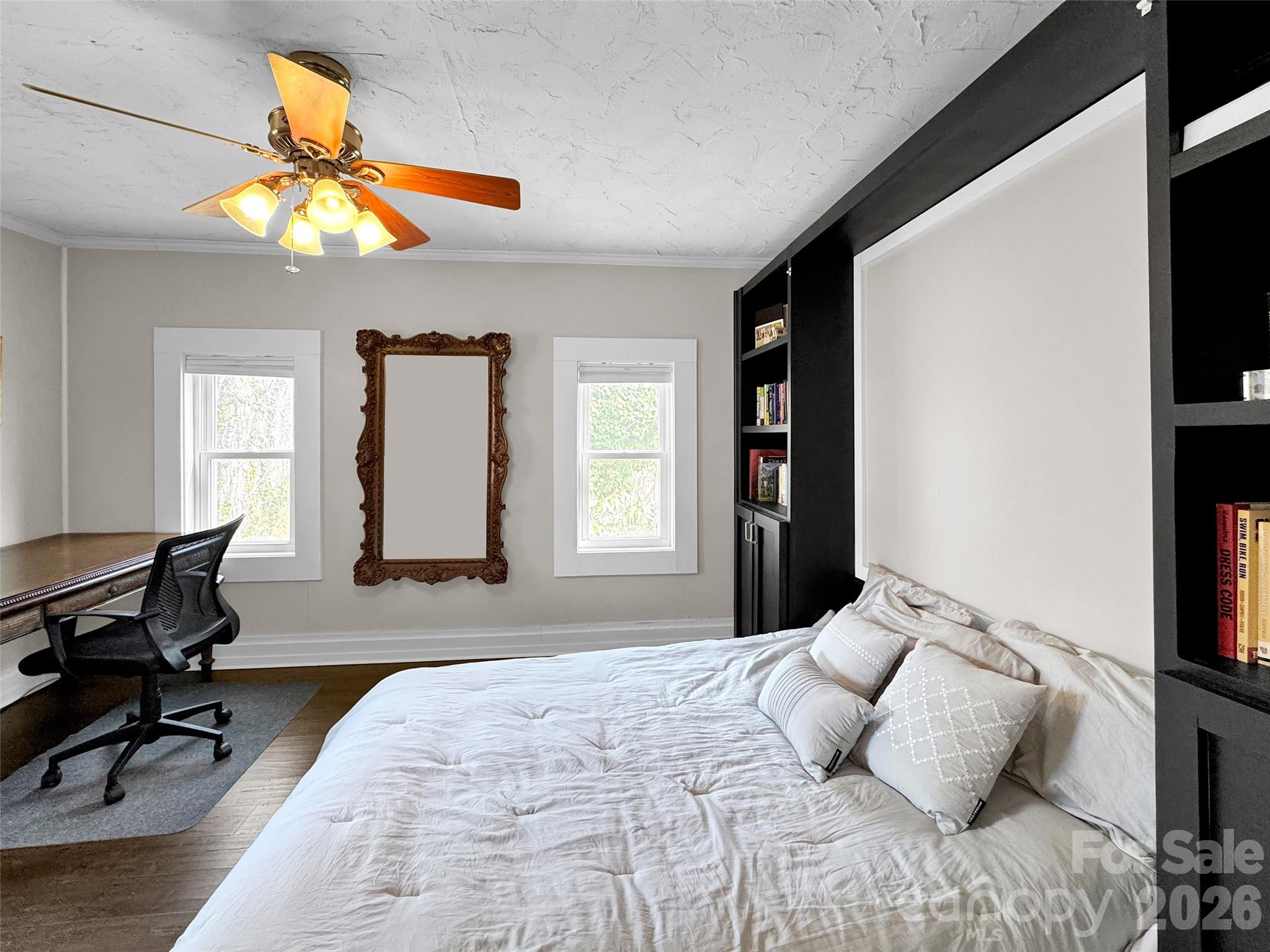 43 Melton Road Candler, NC 28715 - Photo 8 of 44 a bedroom with a bed and a window