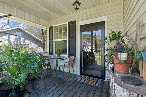 a house view with a seating space and garden