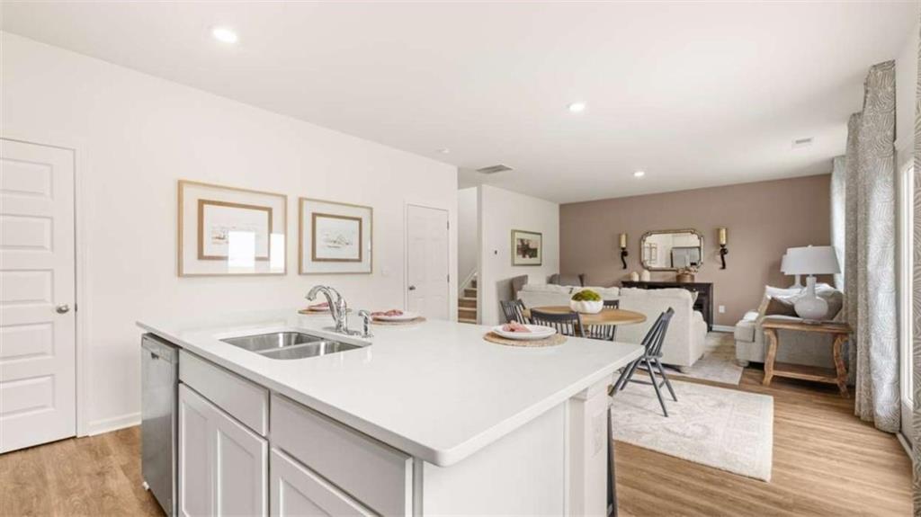 318 Friendship Oak Way Hampton, GA 30228 - Photo 12 of 41 a living room with furniture and a wooden floor
