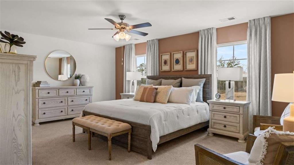 318 Friendship Oak Way Hampton, GA 30228 - Photo 17 of 41 a bedroom with a bed a chandelier and dresser