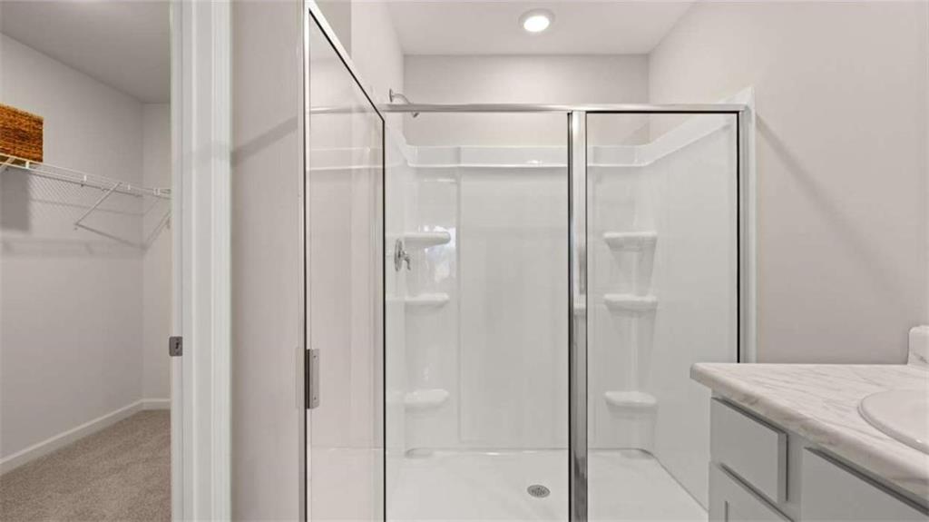 318 Friendship Oak Way Hampton, GA 30228 - Photo 23 of 41 a bathroom with a shower and sink