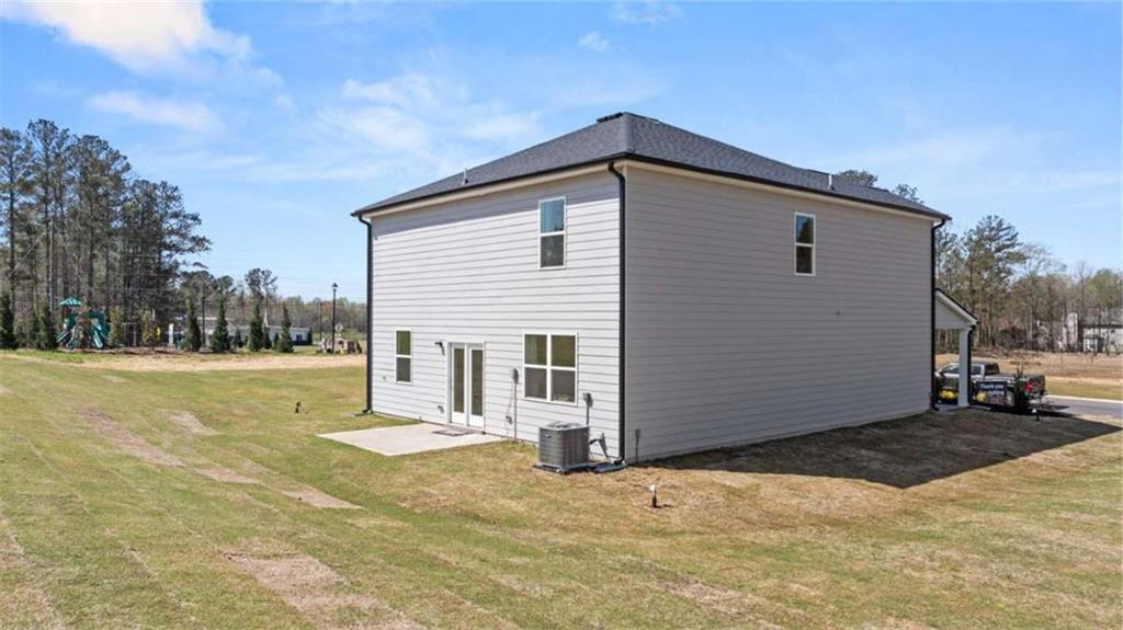 318 Friendship Oak Way Hampton, GA 30228 - Photo 34 of 41 a view of a house with a yard