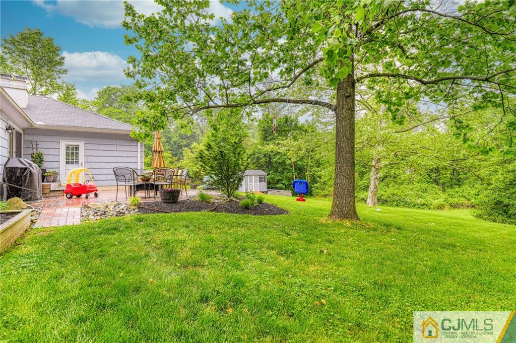 3 Spruce Lane Princeton, NJ 08540 - Photo 33 of 34 a view of a backyard with table and chairs and potted plants