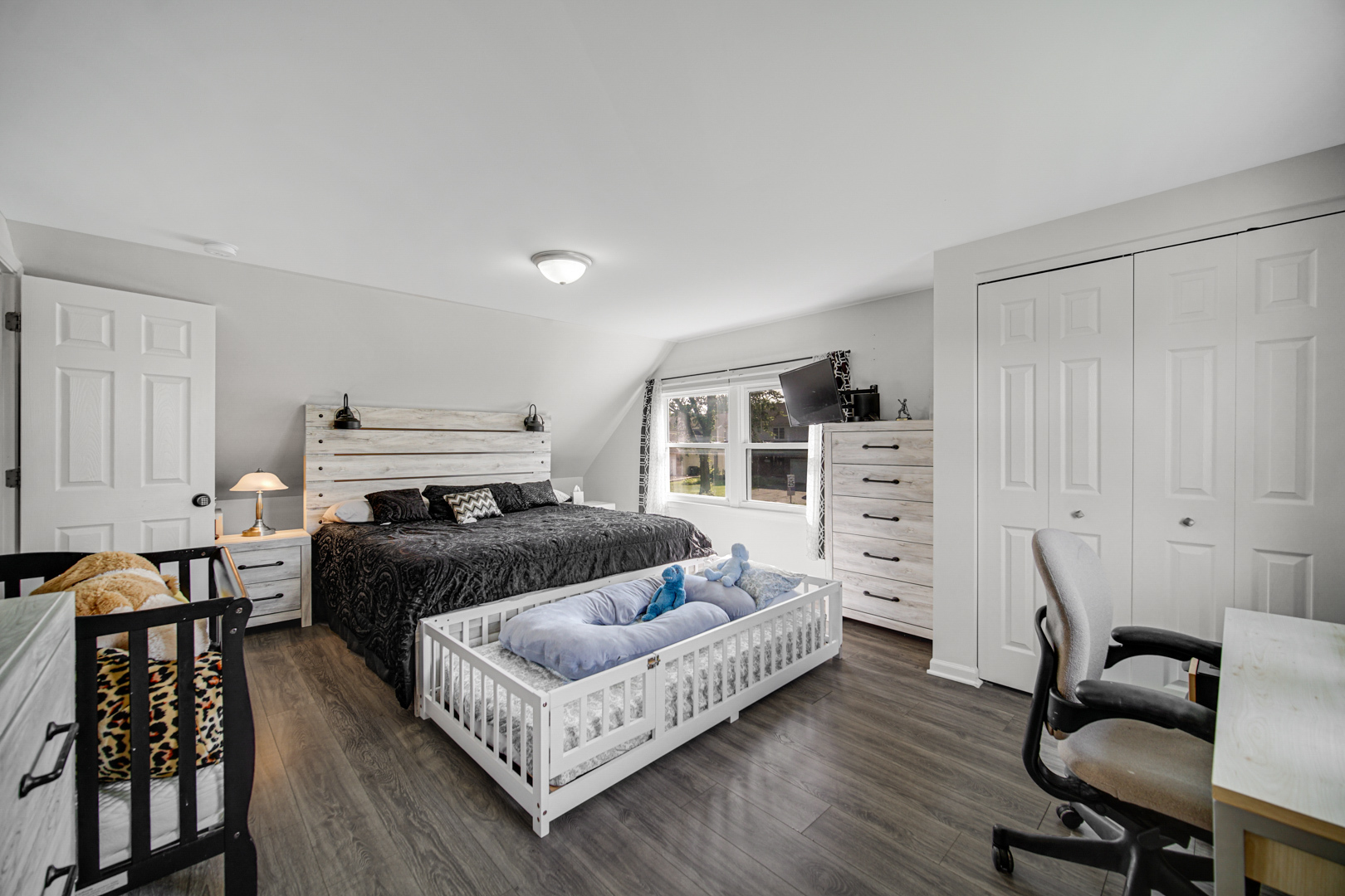 25W277 Doris Avenue Carol Stream, IL 60188 - Photo 12 of 27 a bedroom with furniture and a wooden floor