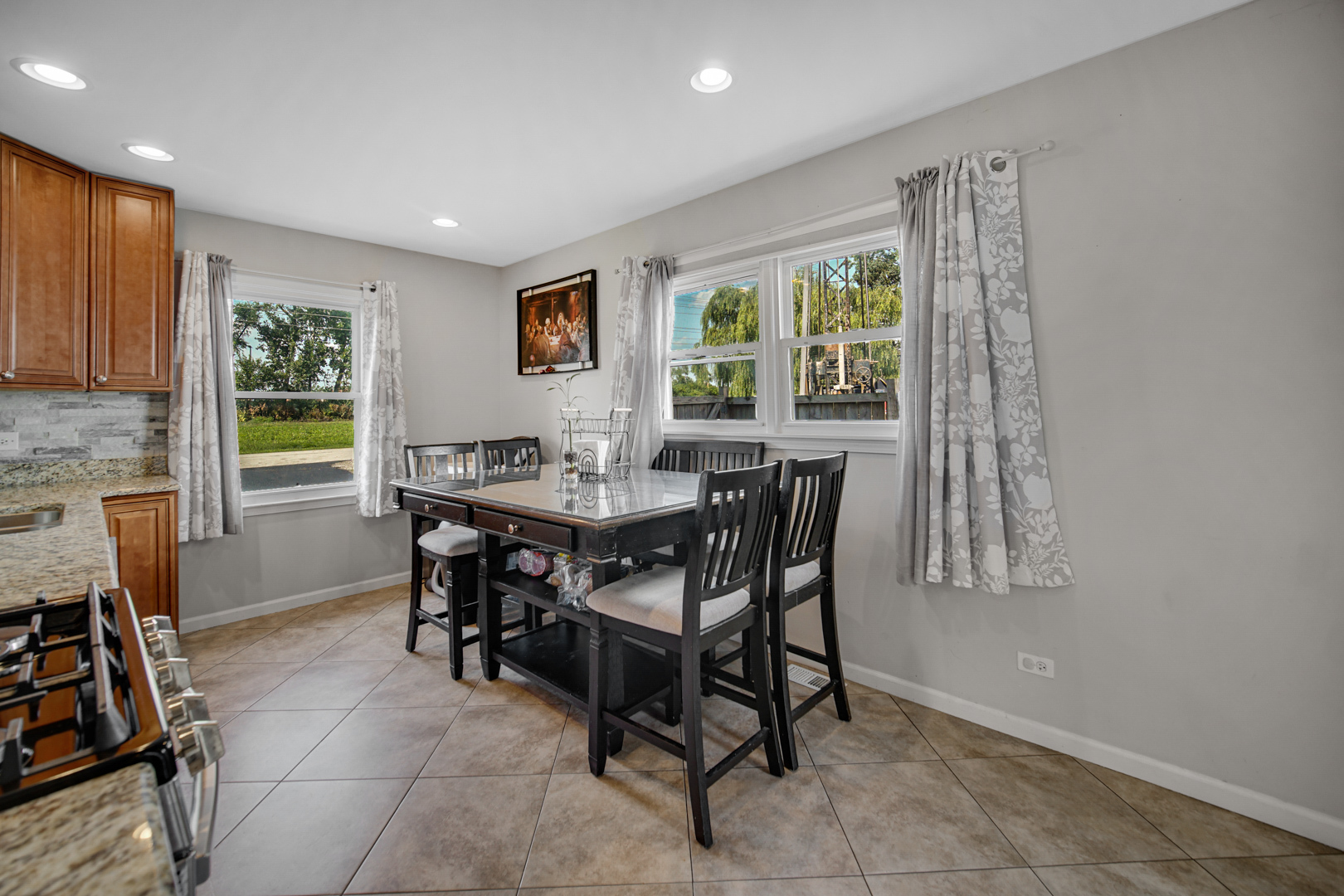 25W277 Doris Avenue Carol Stream, IL 60188 - Photo 9 of 27 a view of a dining room with furniture and a window