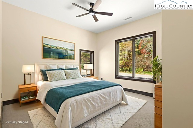 790 Howard Edmisten Road Sugar Grove, NC 28679 - Photo 15 of 45 a bedroom with a large bed and a window