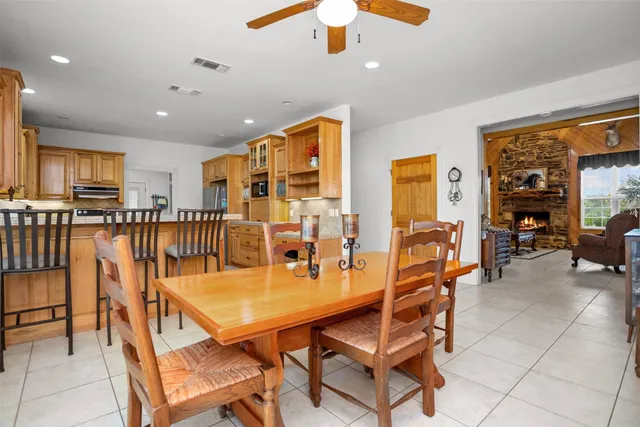 a dining room with furniture and window
