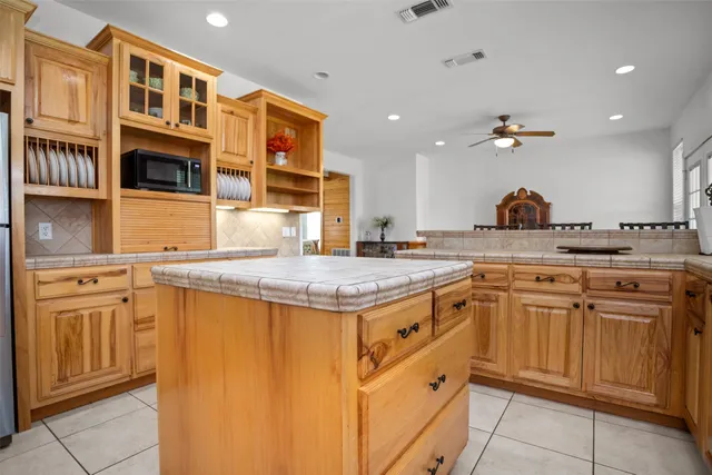a kitchen with stainless steel appliances granite countertop a stove and a sink
