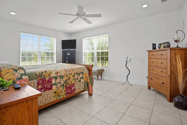 a bedroom with a bed and a dresser