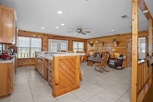 a utility room with stainless steel appliances lots of stuff