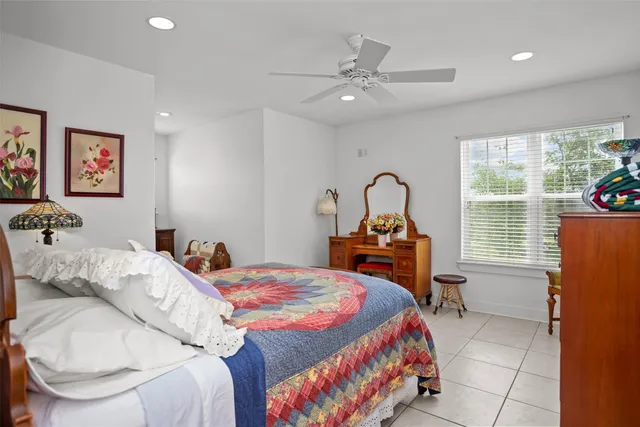 a bedroom with a bed and a table in it