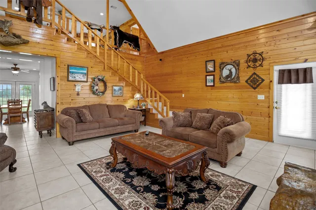 a living room with furniture and a rug