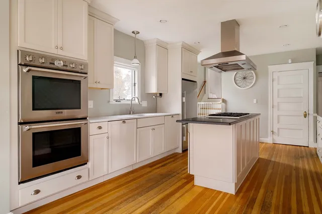 a kitchen with a stove and a microwave