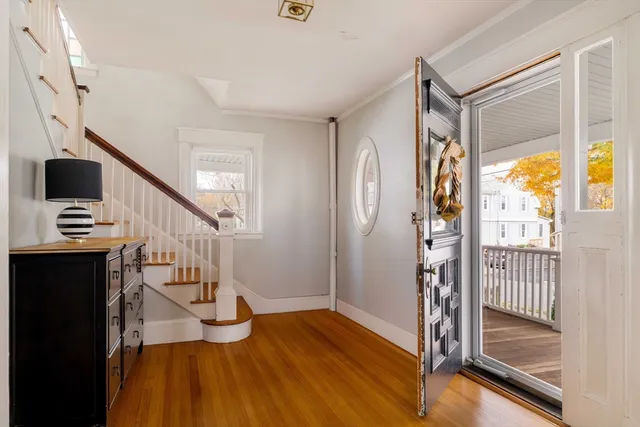 a view of entryway with wooden floor and door