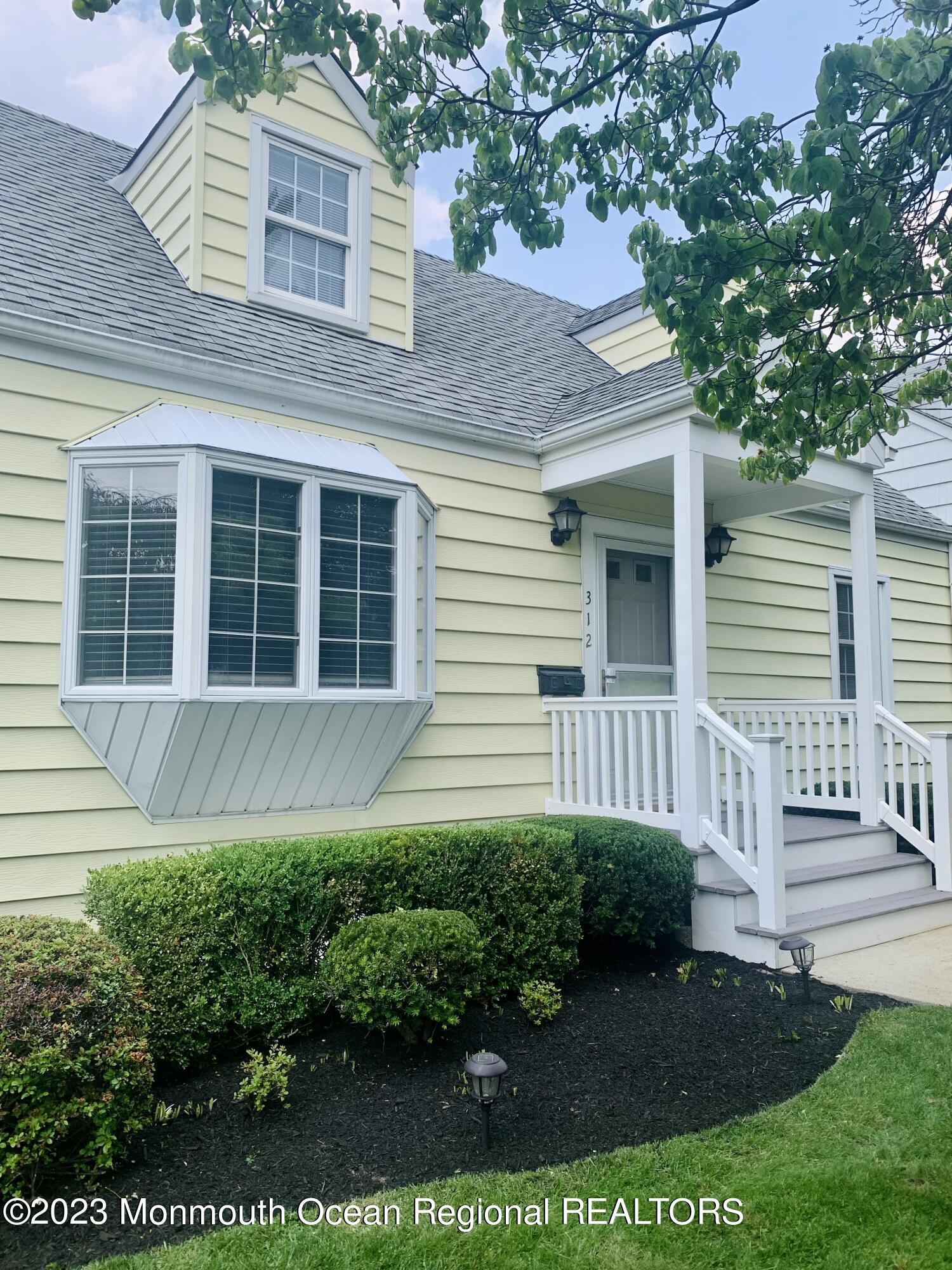 312 Salem Avenue Spring Lake, NJ 07762 - Photo 2 of 18 a front view of a house with a yard