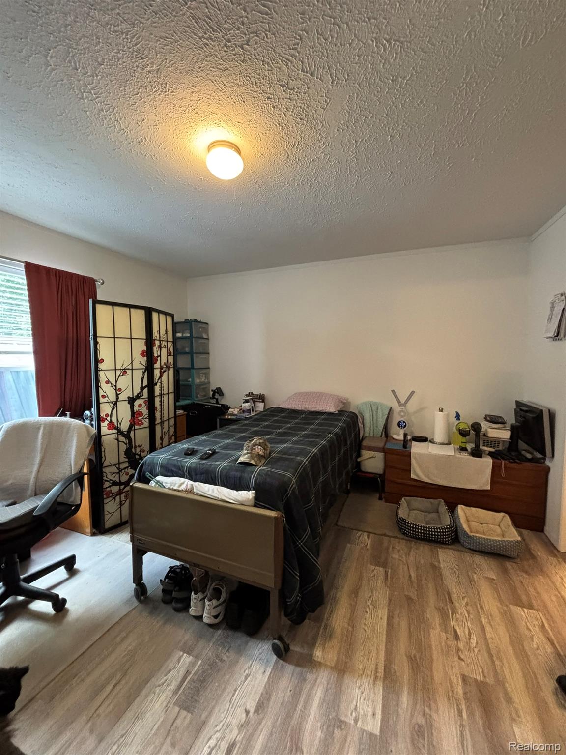 4101 South Sheridan Road Lennon, MI 48449 - Photo 10 of 20 Room with wood-finish flooring, a window with blinds, and light-toned walls