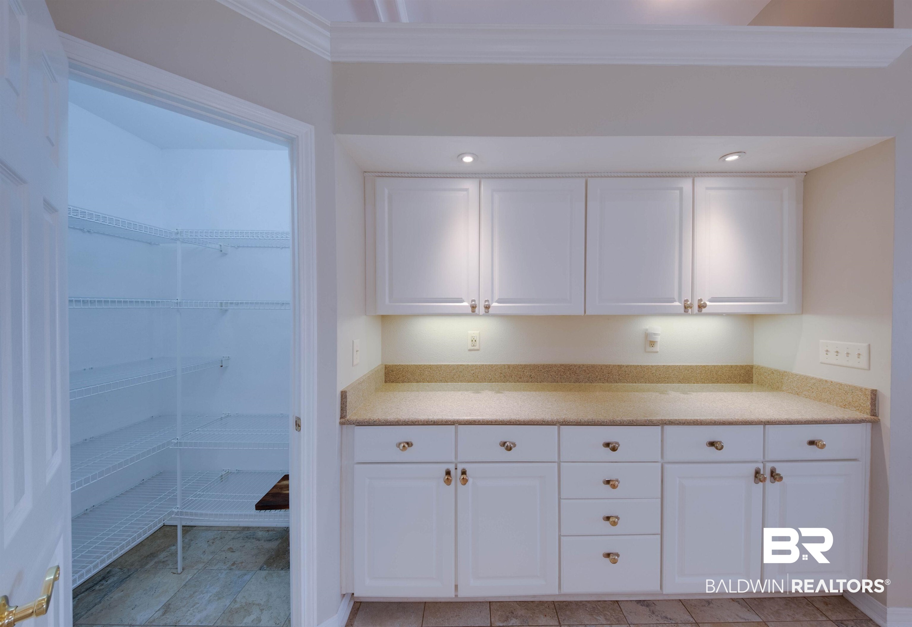 9462 Lakeview Drive Foley, AL 36535 - Photo 16 of 50 Kitchen featuring ornamental molding and white cabinets