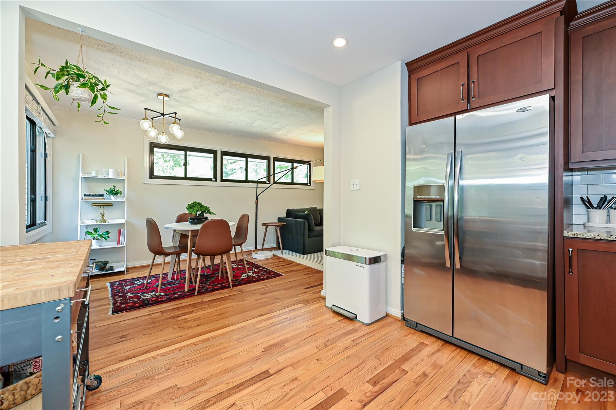 4609 Murrayhill Road Charlotte, NC 28209 - Photo 13 of 38 a living room with furniture a fireplace and a potted plant