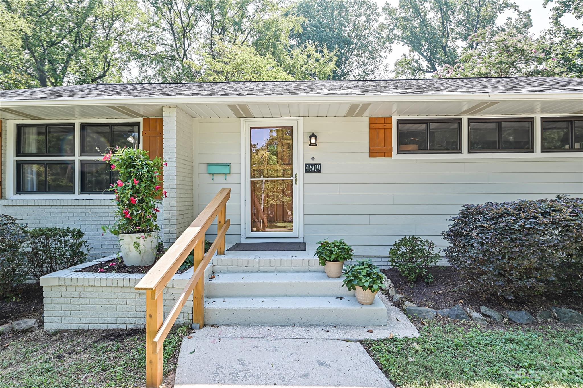 4609 Murrayhill Road Charlotte, NC 28209 - Photo 2 of 38 a view of a house with potted plants