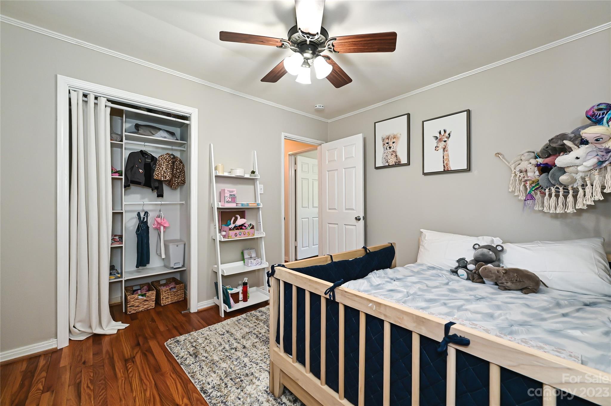 4609 Murrayhill Road Charlotte, NC 28209 - Photo 29 of 38 a bedroom with a bed and wooden floor
