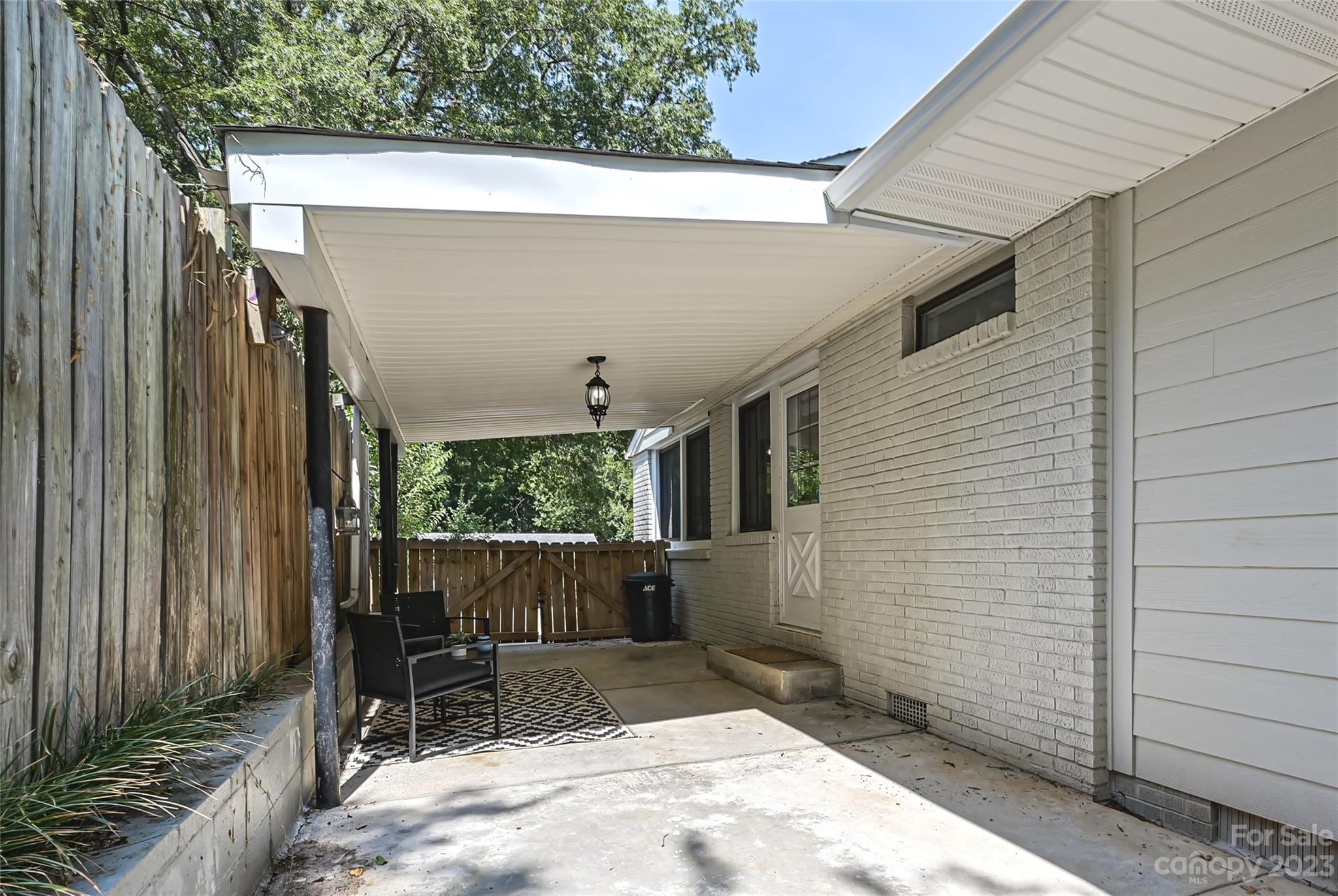 4609 Murrayhill Road Charlotte, NC 28209 - Photo 35 of 38 a view of house with backyard and furniture