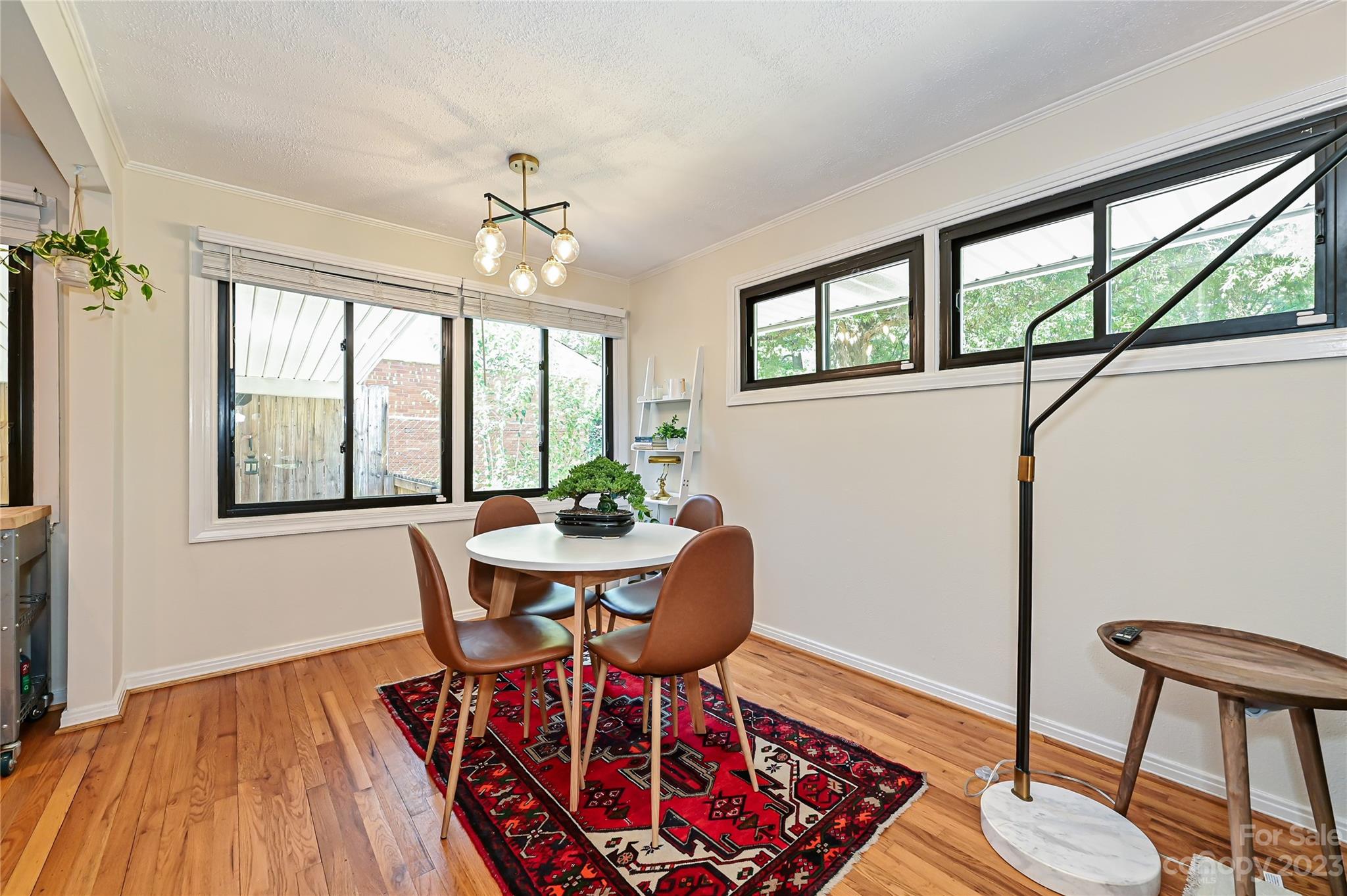 4609 Murrayhill Road Charlotte, NC 28209 - Photo 8 of 38 a view of a dining room with furniture window and wooden floor